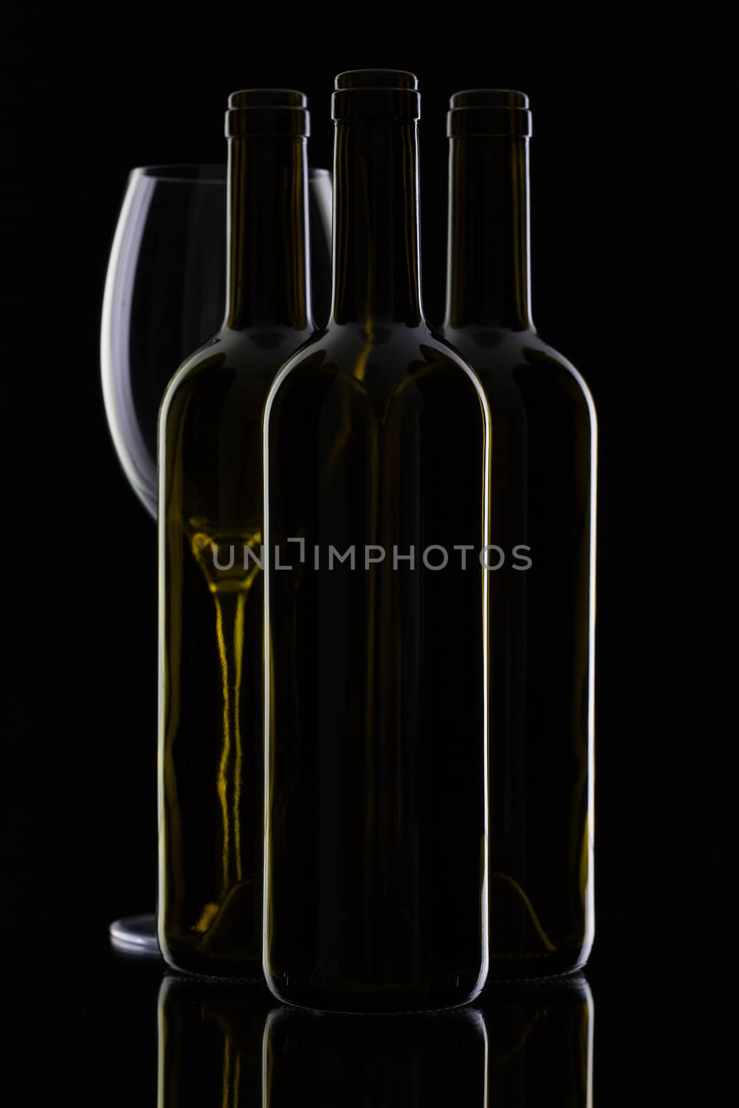 Three different bottles of wine by CaptureLight