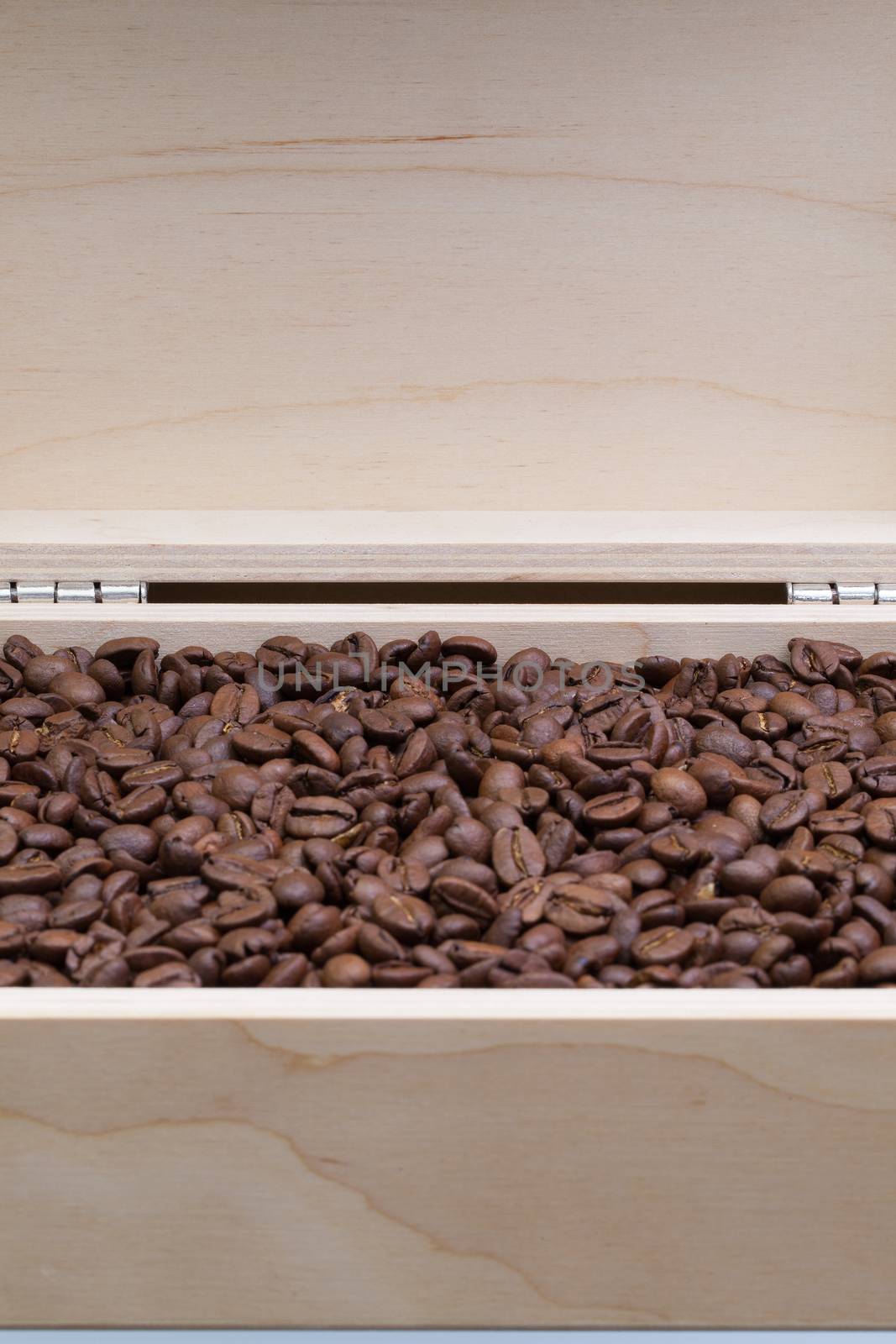 Coffee beans in an open box by CaptureLight
