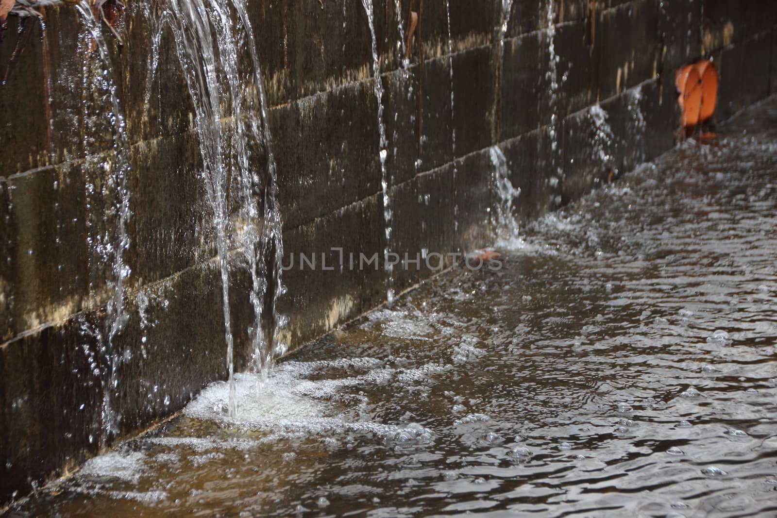 Embankment under Water Pressure with Water Spraying and creating small waterfall