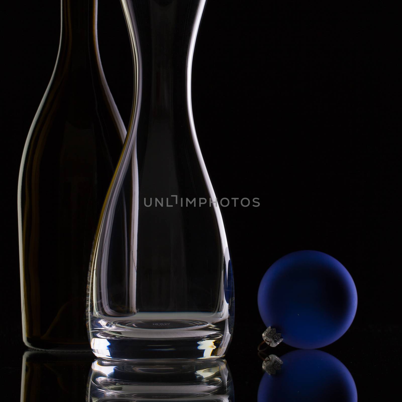 The bottle of wine,glass carafe and Christmas decoration  by CaptureLight