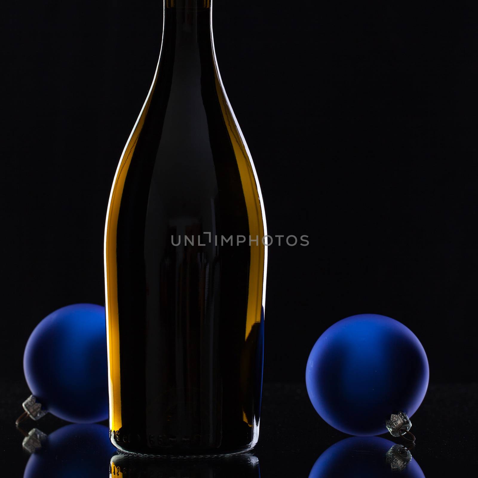 The bottle of red wine and Christmas decoration  by CaptureLight