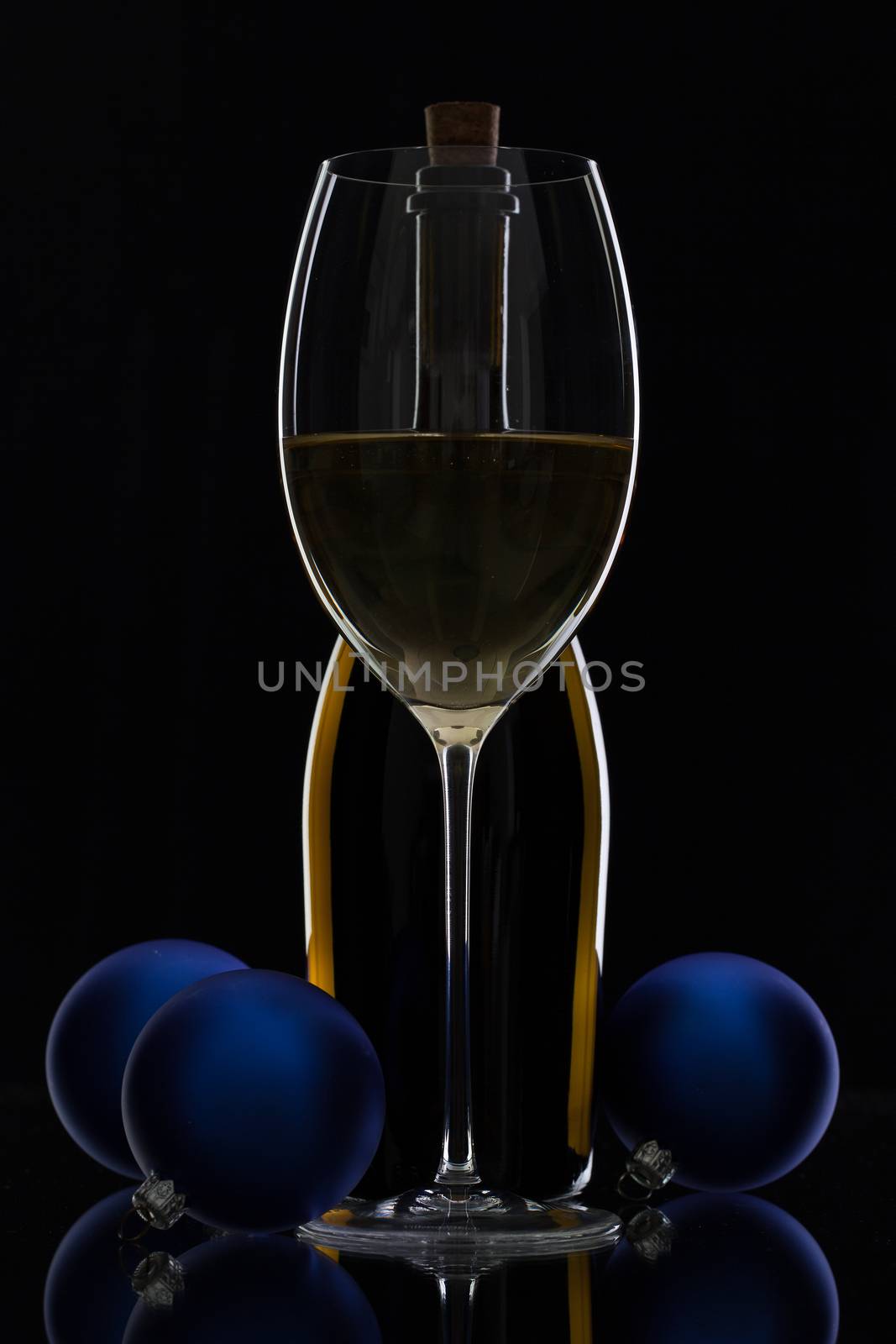 The bottle of white  wine and Christmas decoration  by CaptureLight