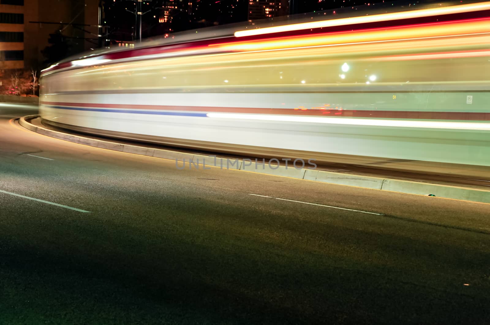 UTA Trax train in motion at night