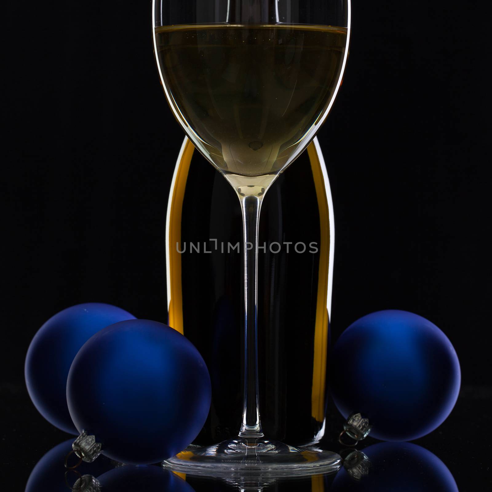 The bottle of white wine and Christmas decoration  by CaptureLight