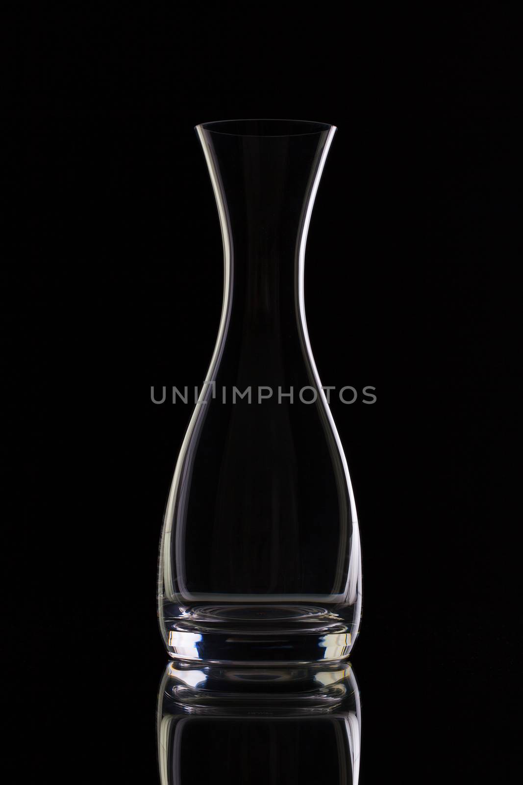 Empty glass on water on the black glass desk