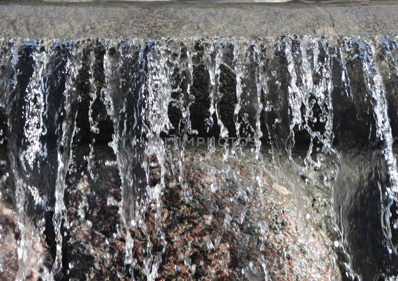 Isolated Waterfall from Flooded Rock Urban Fountain Background