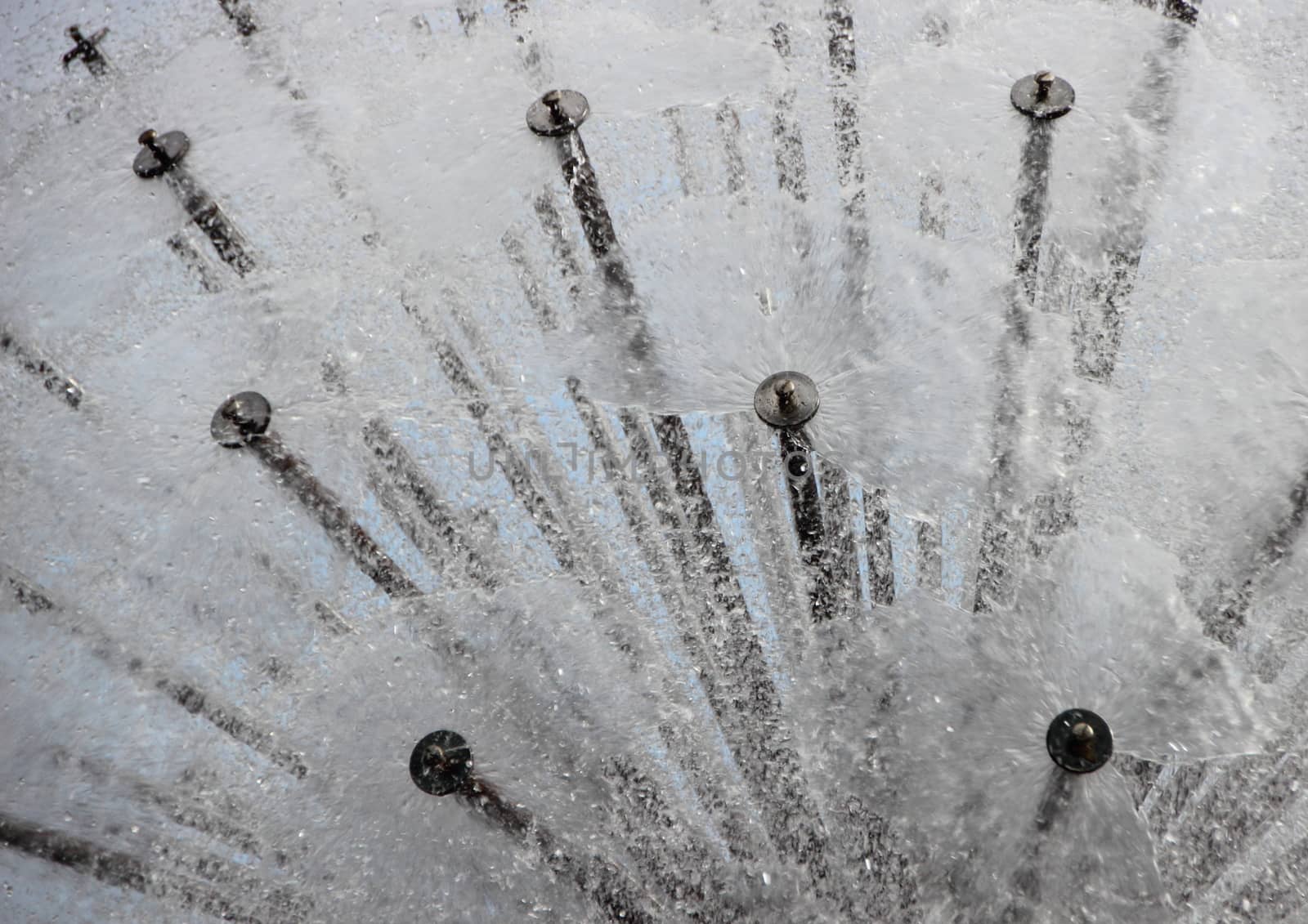 Water Splash Abstract Background from Circular Steel Tube Fountain