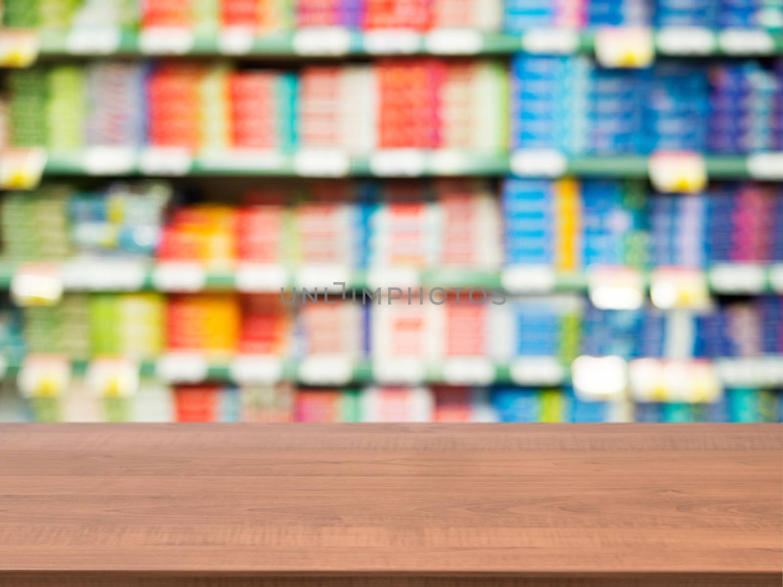 Wooden empty table in front of blurred supermarket by fascinadora