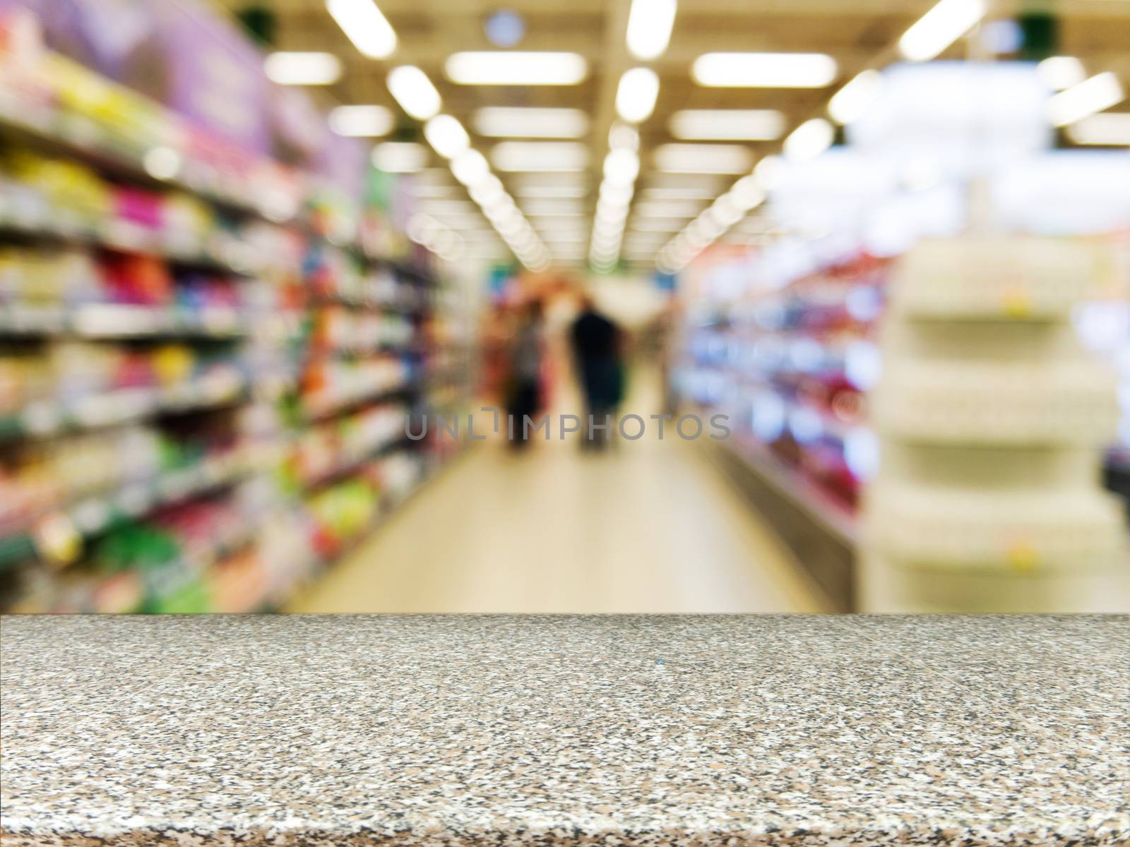 Marble board empty table in front of blurred background. Perspective marble over blur in supermarket - can be used for display or montage your products. Mock up for display of product.