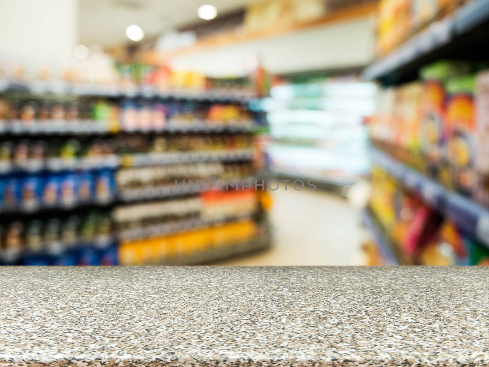 Marble board empty table in front of blurred background. Perspective marble over blur in supermarket - can be used for display or montage your products. Mock up for display of product.