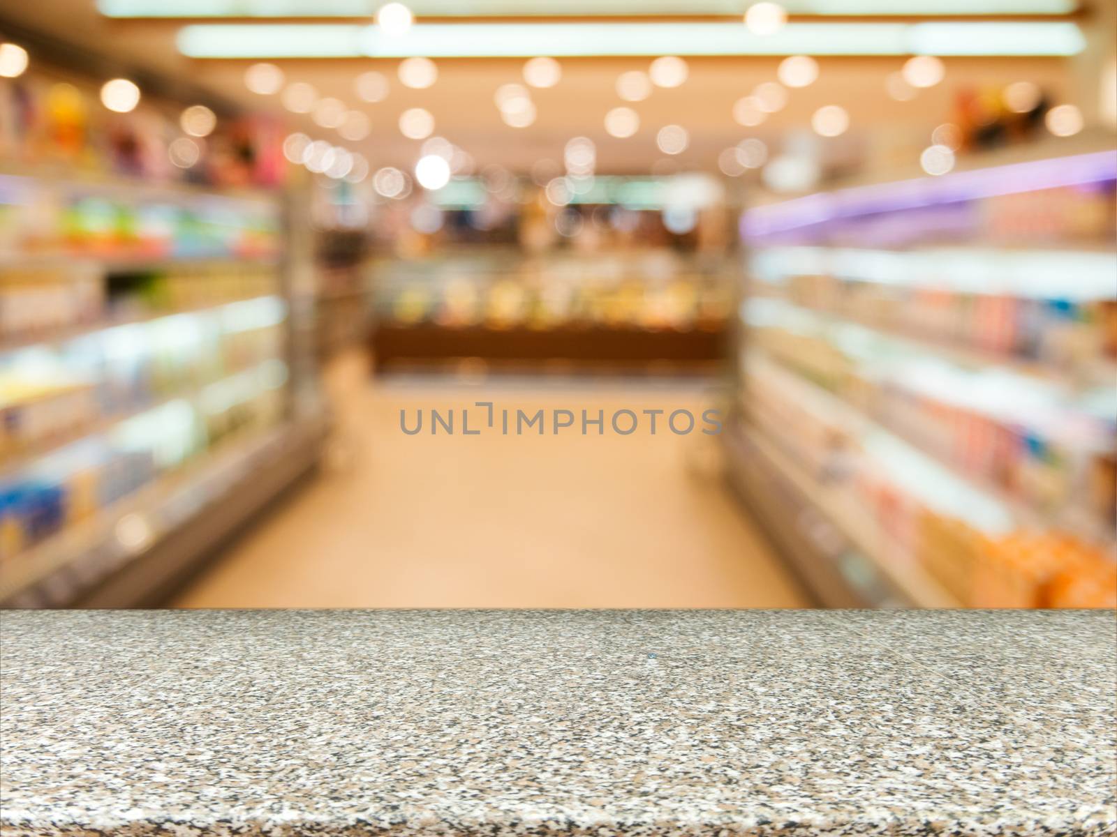 Marble board empty table in front of blurred background. Perspective marble over blur in supermarket - can be used for display or montage your products. Mock up for display of product.