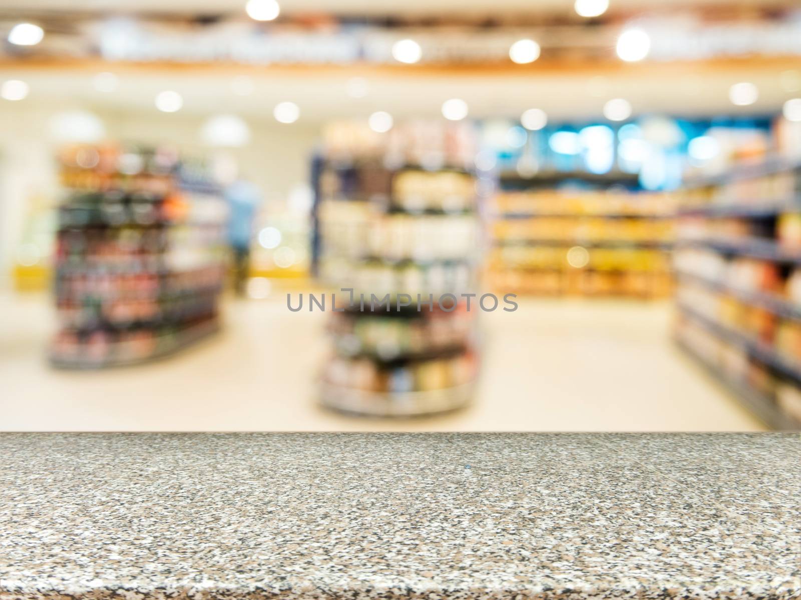 Marble board empty table in front of blurred background. Perspective marble over blur in supermarket - can be used for display or montage your products. Mock up for display of product.