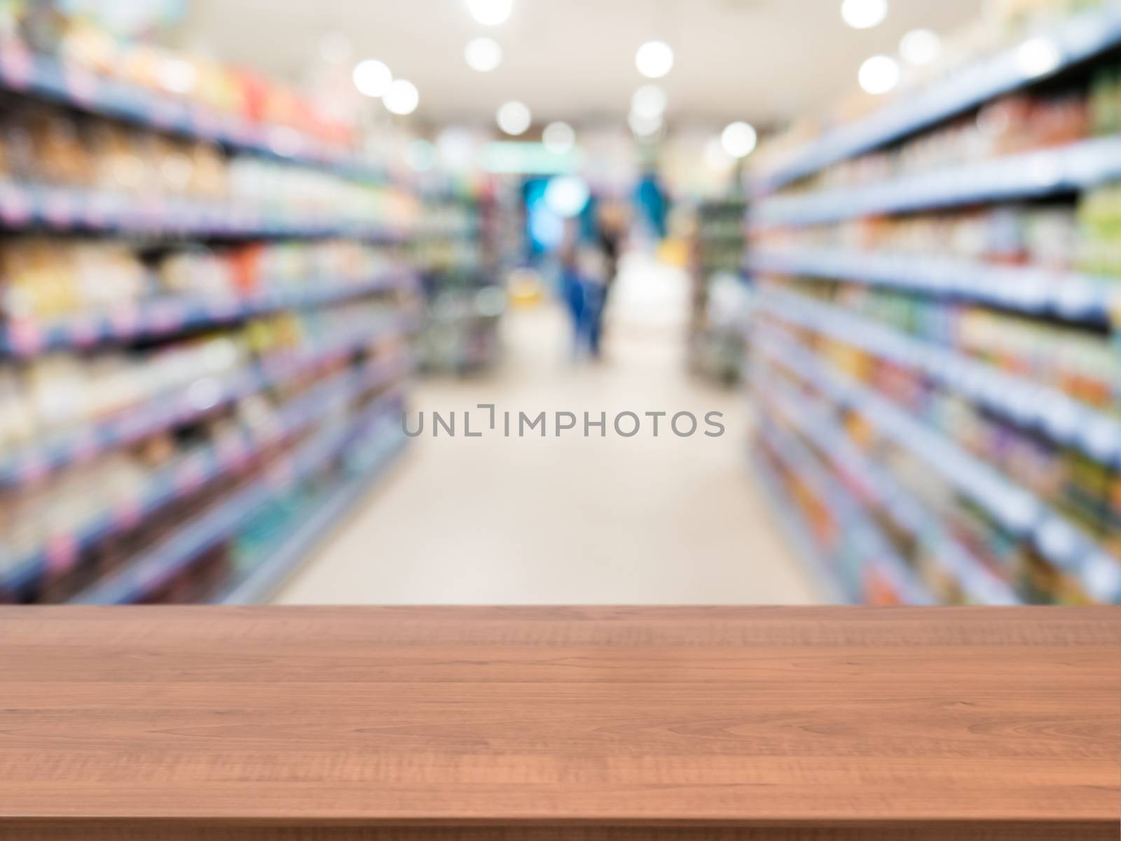 Wooden board empty table in front of blurred background. Perspective light wood over blur in supermarket - can be used for display or montage your products. Mock up for display of product.