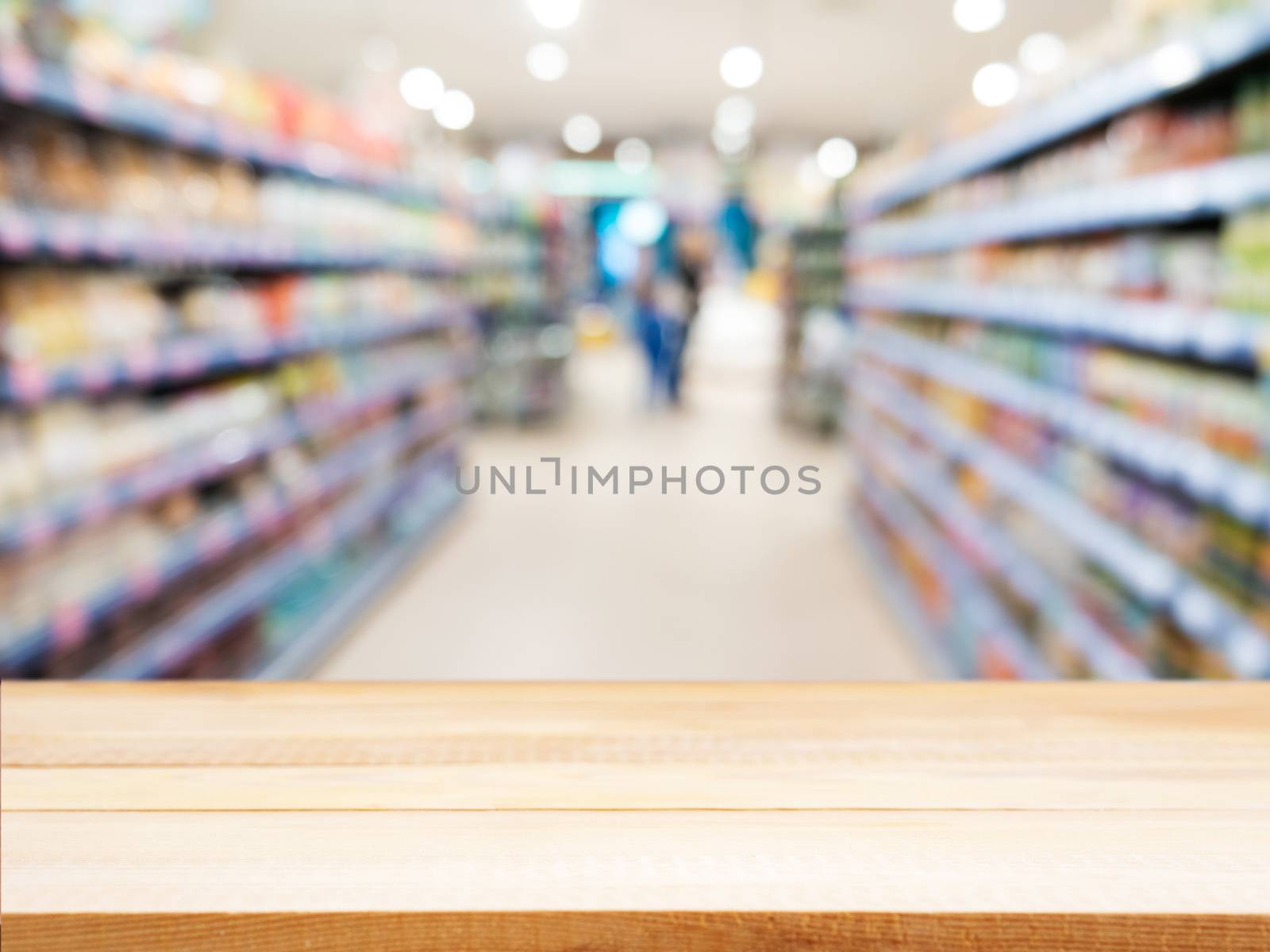 Wooden board empty table in front of blurred background. Perspective light wood over blur in supermarket - can be used for display or montage your products. Mock up for display of product.