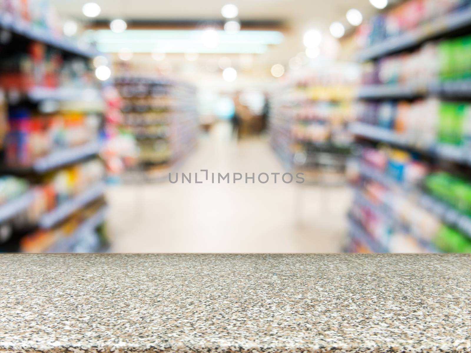 Marble board empty table in front of blurred background. Perspective marble over blur in supermarket - can be used for display or montage your products. Mock up for display of product.