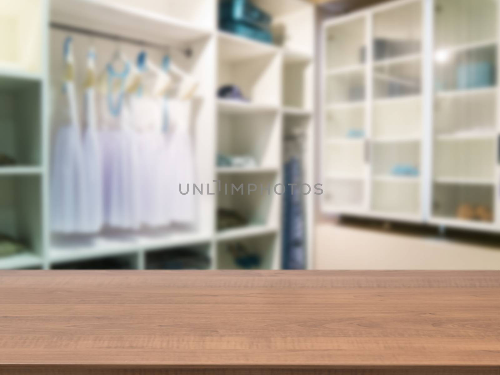 Wooden board empty table in front of blurred background. Perspective dark wood over blur in closet room for background uses. Mock up for display or montage your products