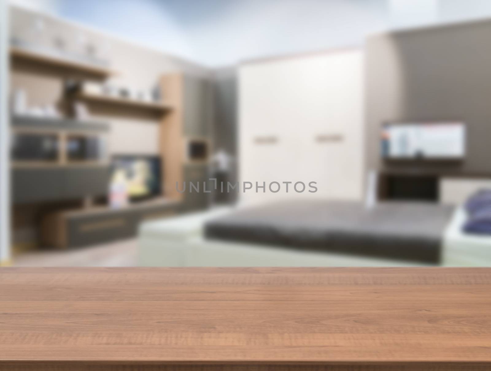 Wooden empty table in front of blurred bedroom by fascinadora