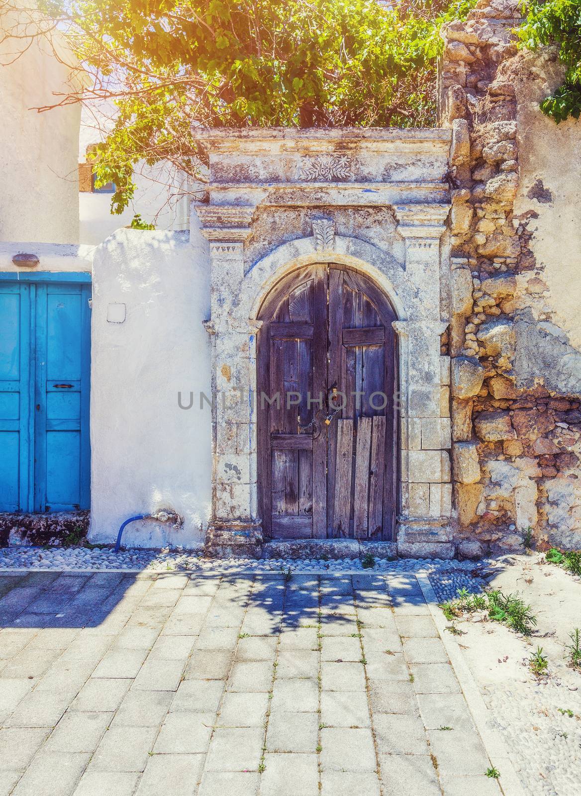 antique door in the colorful  village Koskinou on the island of Rhodes, Greece