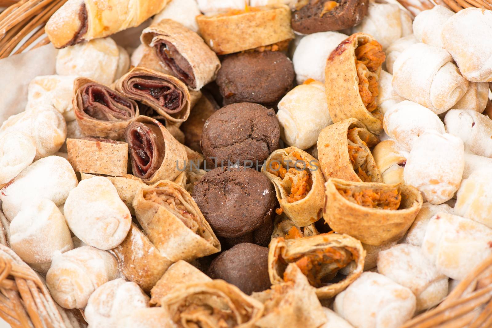 Close-up of sweet bakery products in a wicker basket.