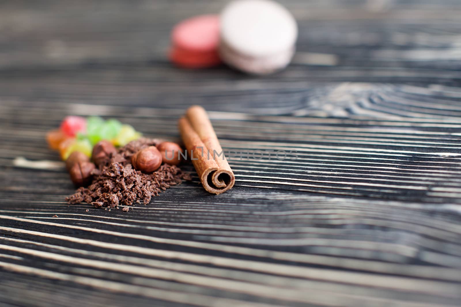 Nuts, cinnamon, candied fruits, chocolate chips lie on the texture table
