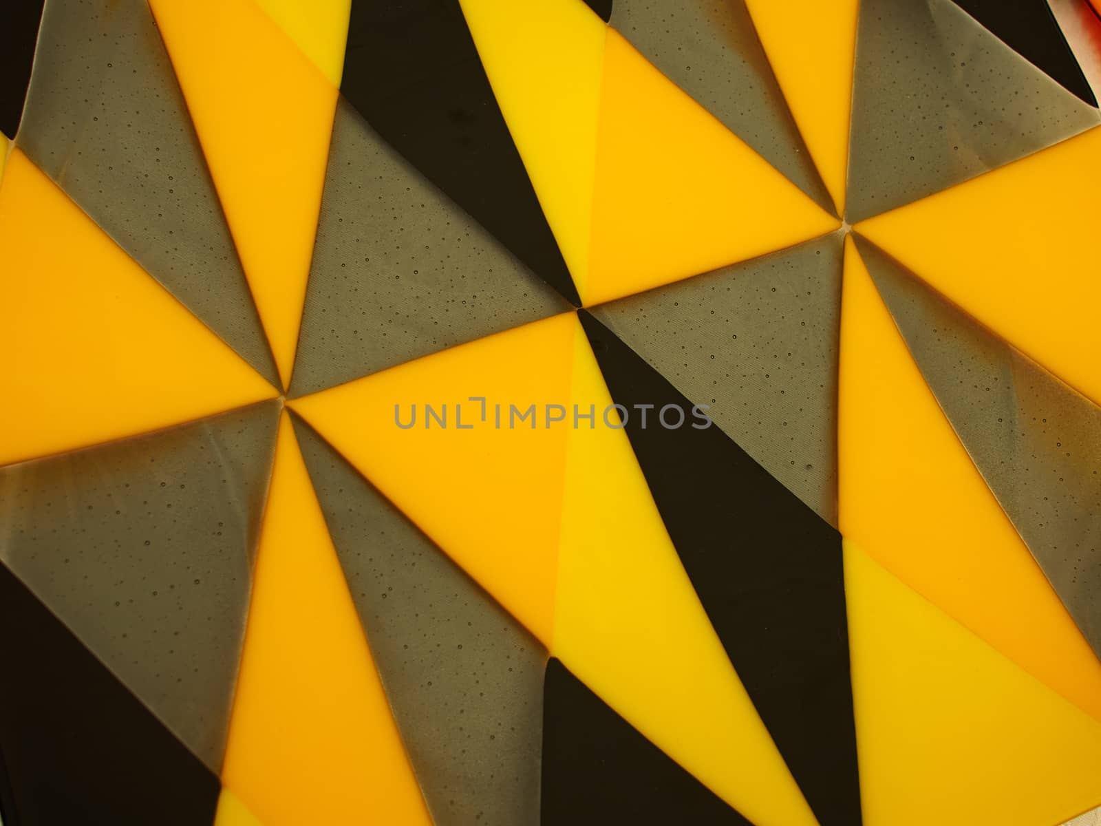 Beautiful creative handmade colored glass texture abstract pattern background yellow and black
