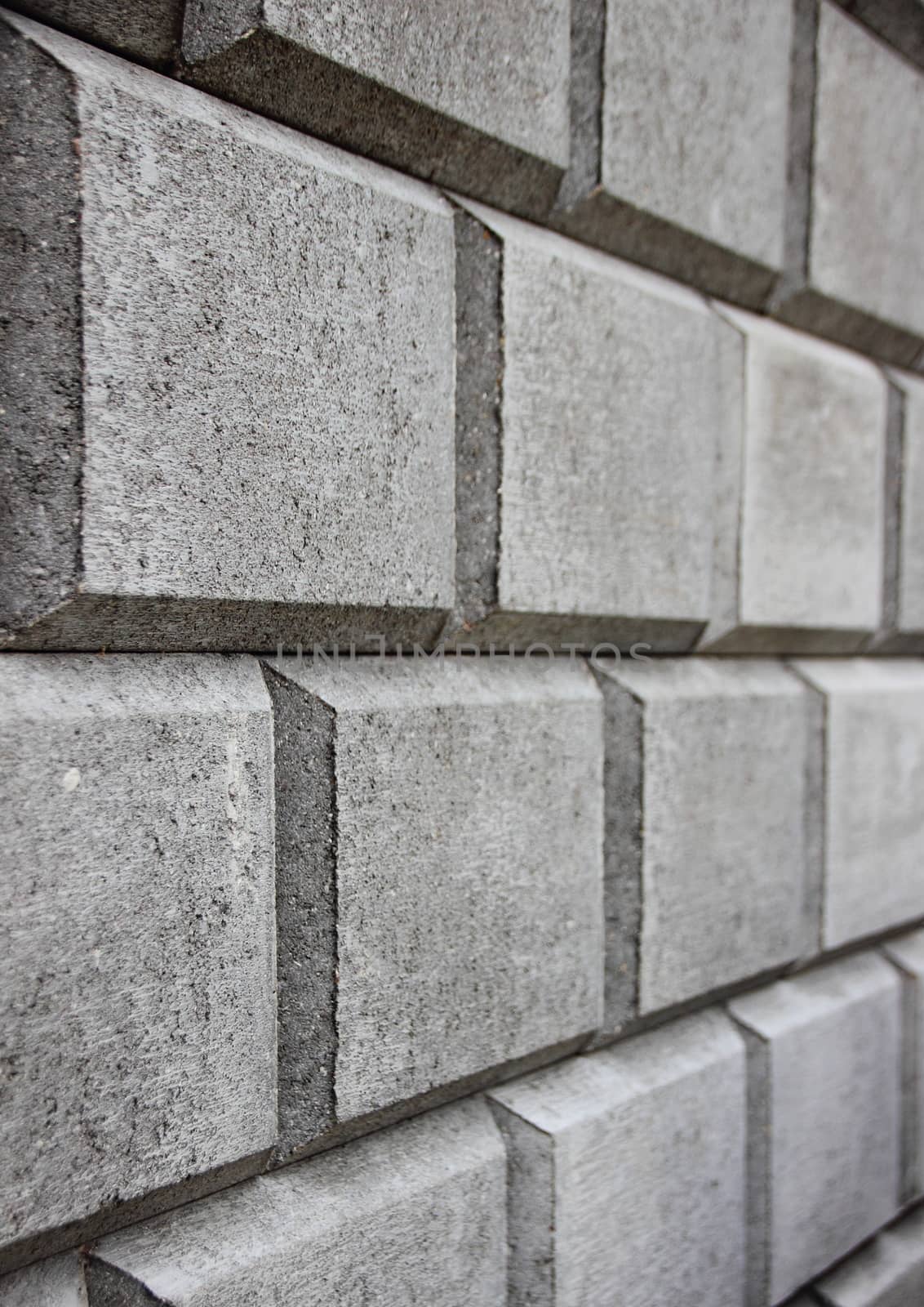 Perspective of  Grey Concrete Brick Closeup Background by HoleInTheBox