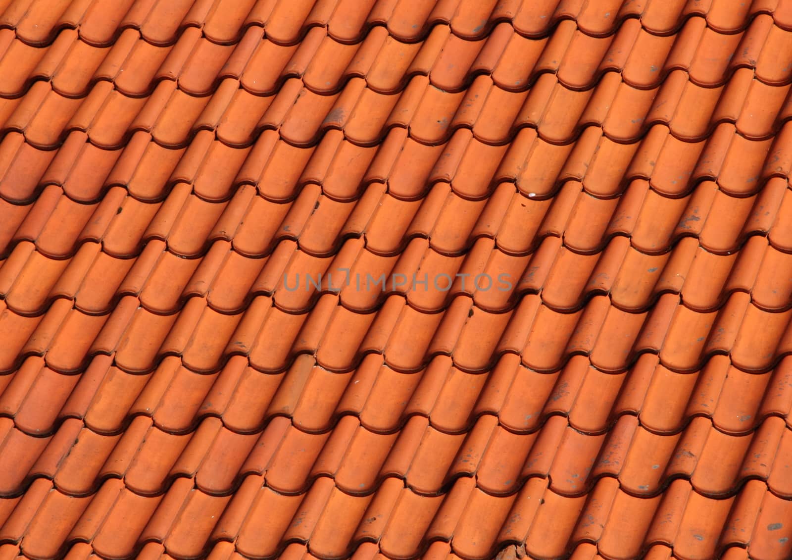 Red Clay Tile Roof on Old Farm House Background by HoleInTheBox