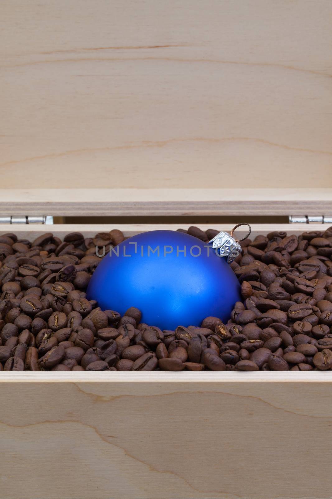Coffee beans and Christmas decoration  in an open box by CaptureLight