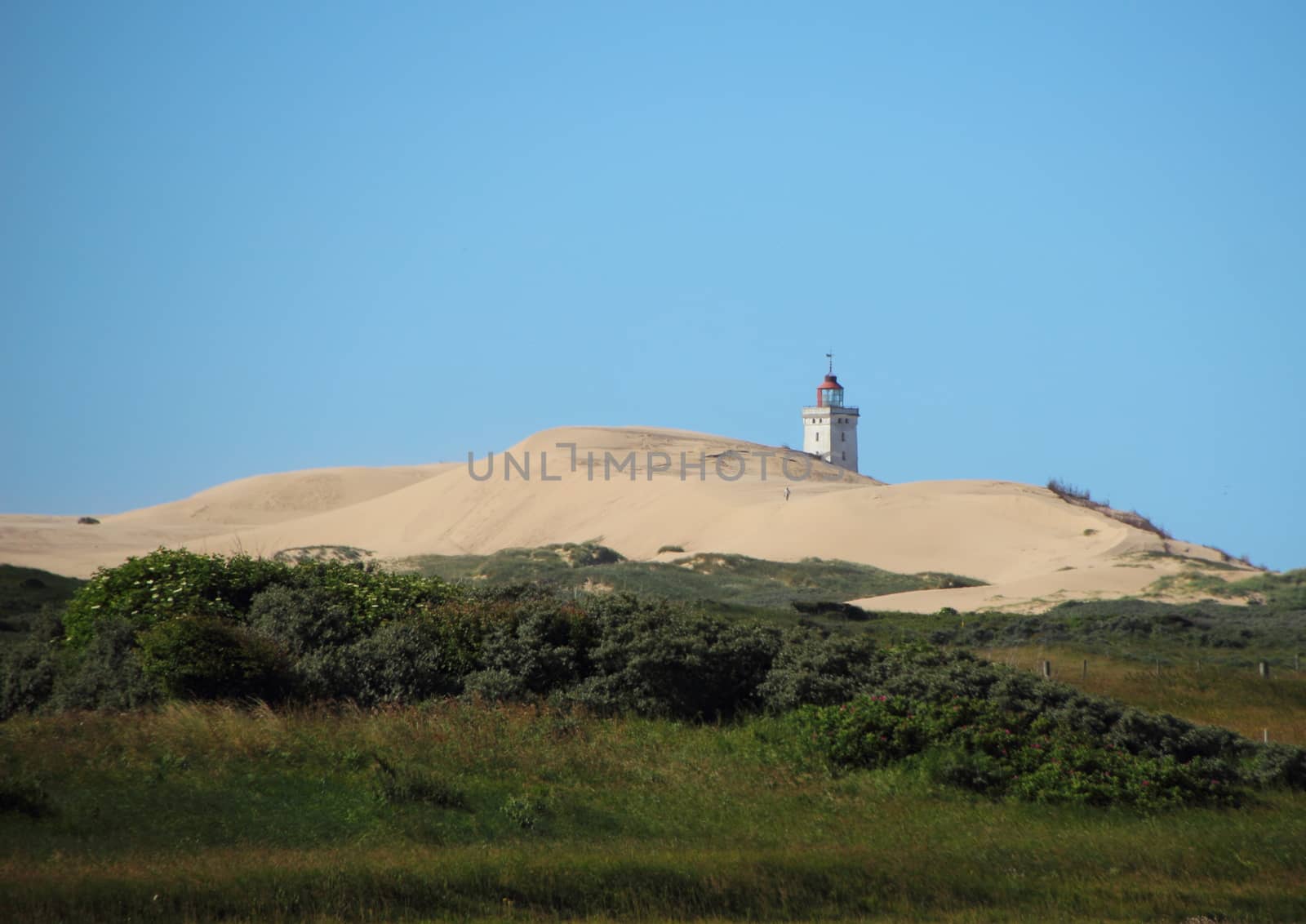 Lighthouse at Rubjerg Knude with Sand dune and Blue Sky by HoleInTheBox