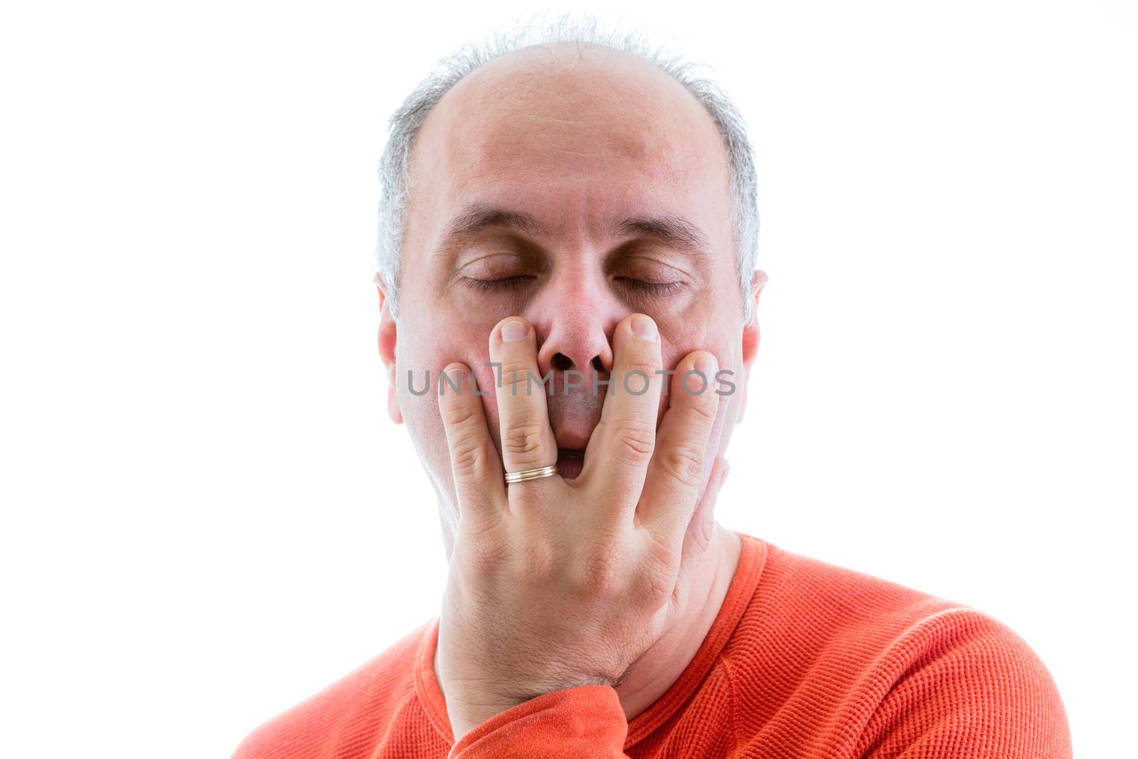 Guilty man with a conscience closing his eyes as he acknowledges to himself that he is responsible and to blame, isolated on white