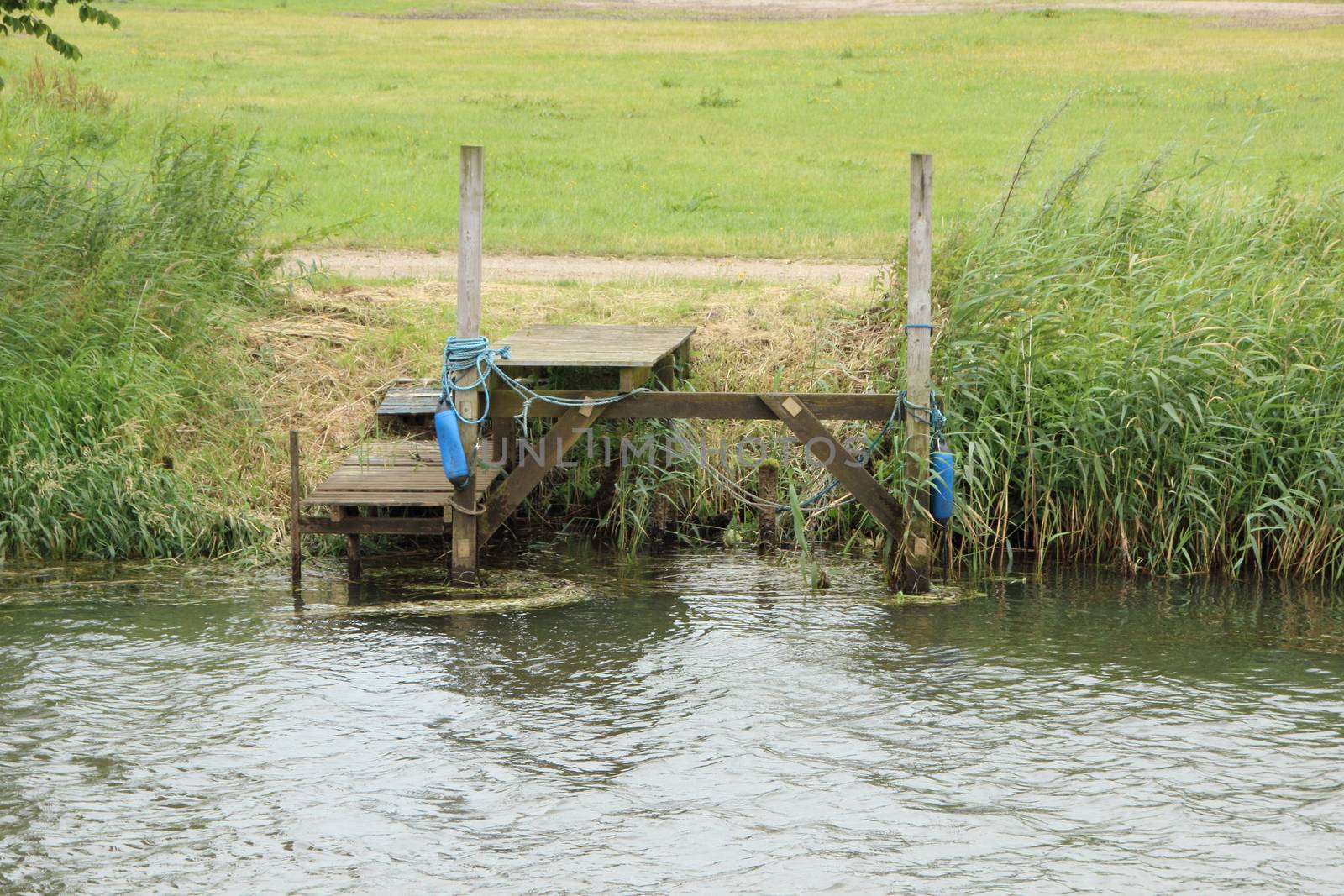 Vacant Landing Stage Jetty at Small River with Reed