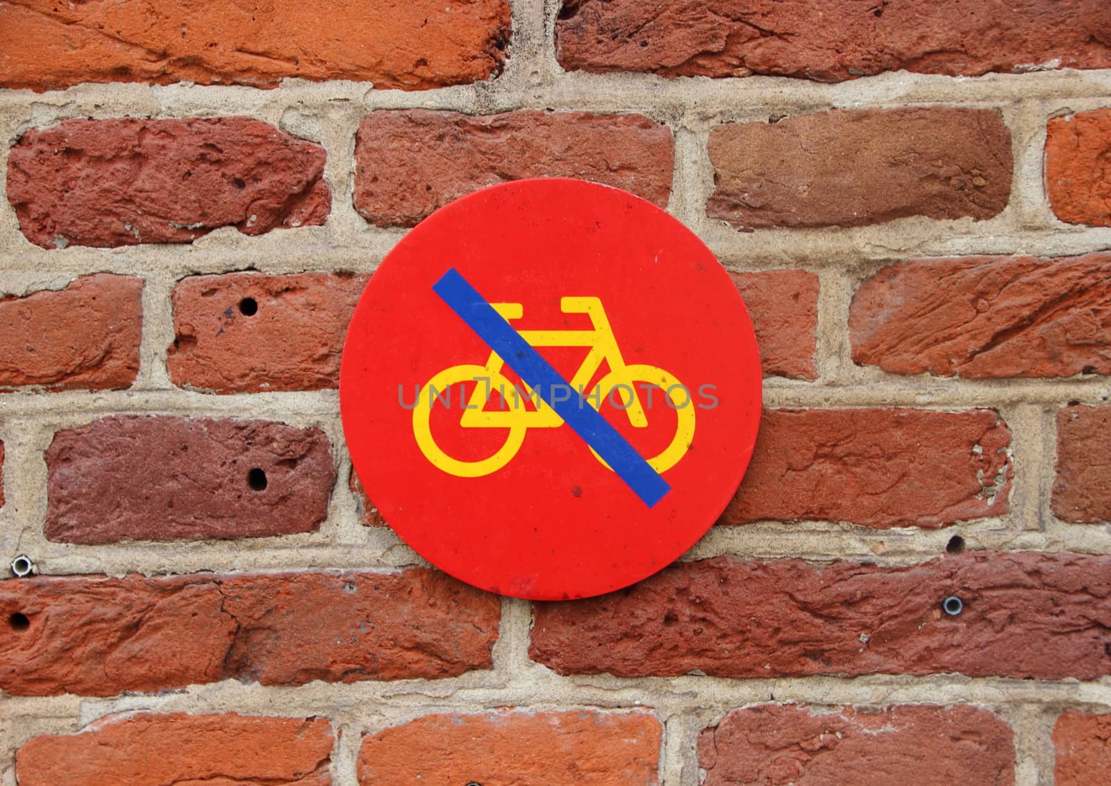 Red No Bicycle Parking Sign on Red Tile Wall