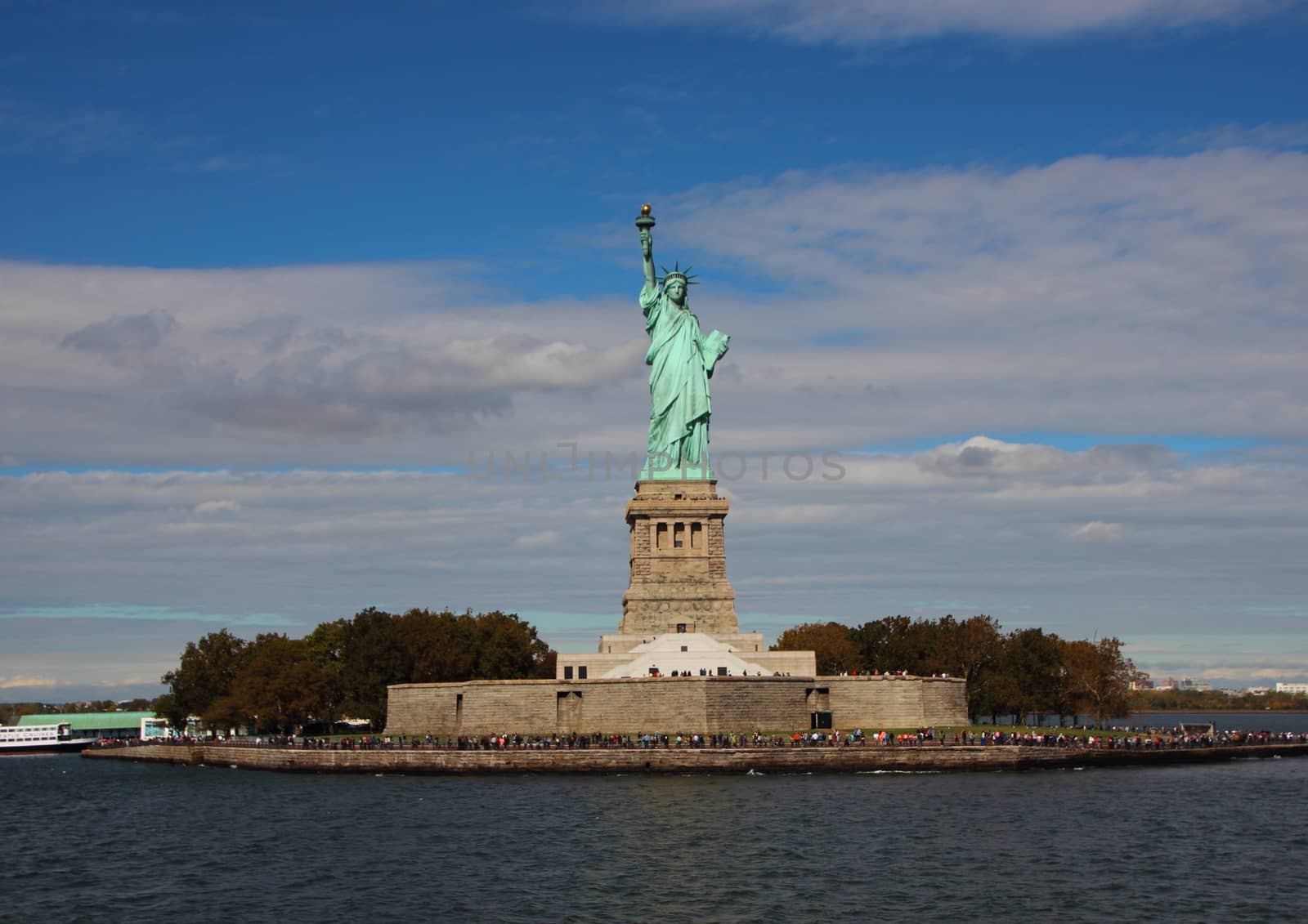 Liberty Island with Statue Front View and Cloudy Background