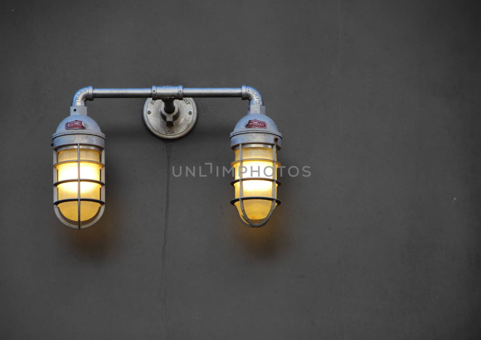 Reinforced City Lamps with Metal Grid on Dark Wall by HoleInTheBox