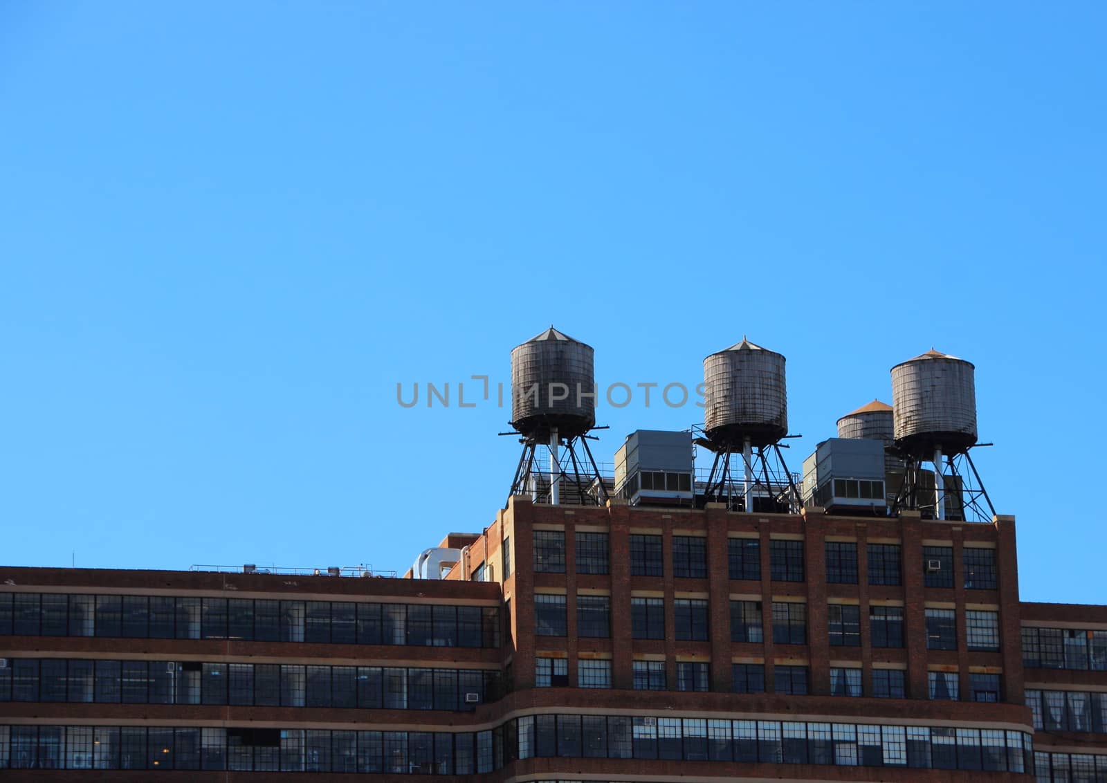 Three Steel Water Reserve Tanks on Rooftop of Building