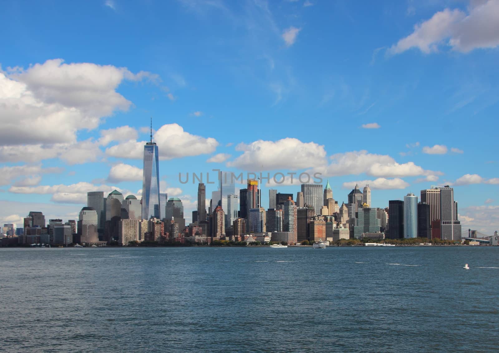 Manhattan Downtown Skyline from Seaside with Blue Sky by HoleInTheBox