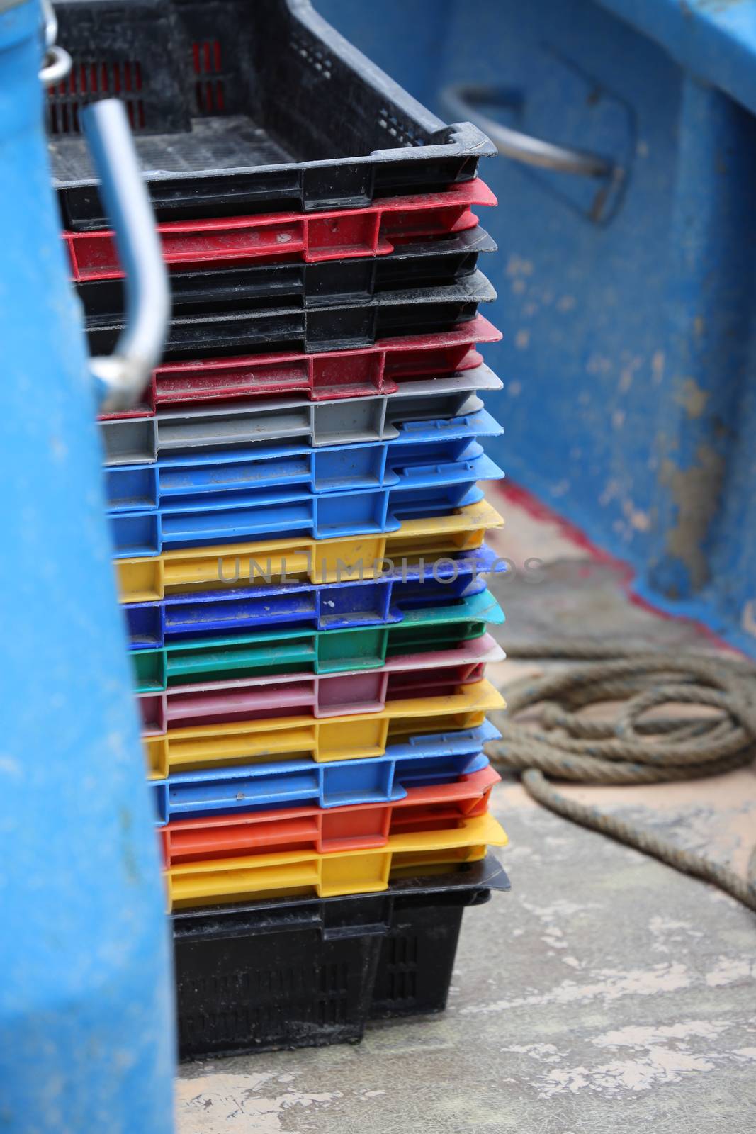 Colourful Stack of Fish Crates on a Vessel