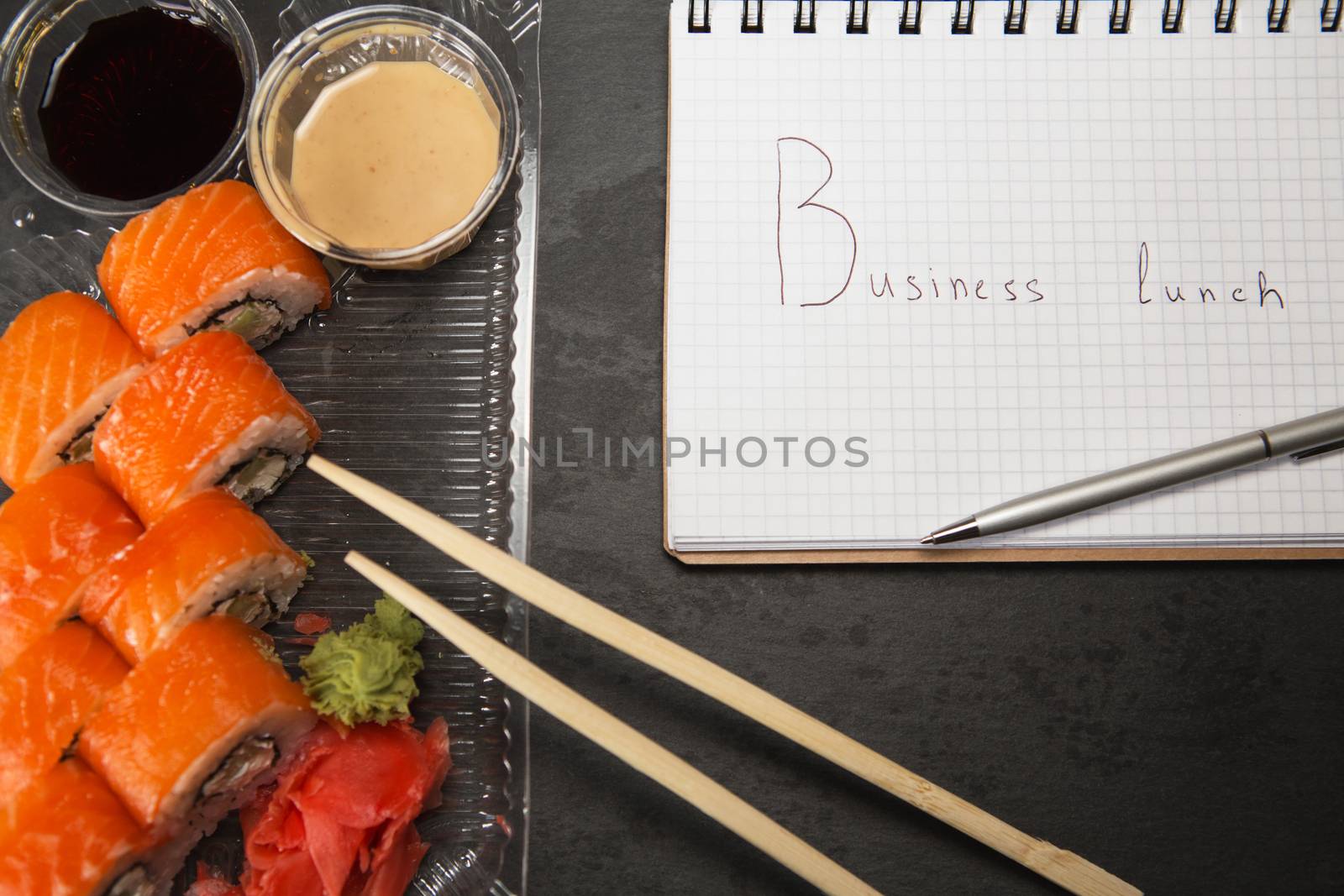 Sushi roll philadelphia. Philadelphia roll in Disposable Plastic Food Container. Business lunch concept