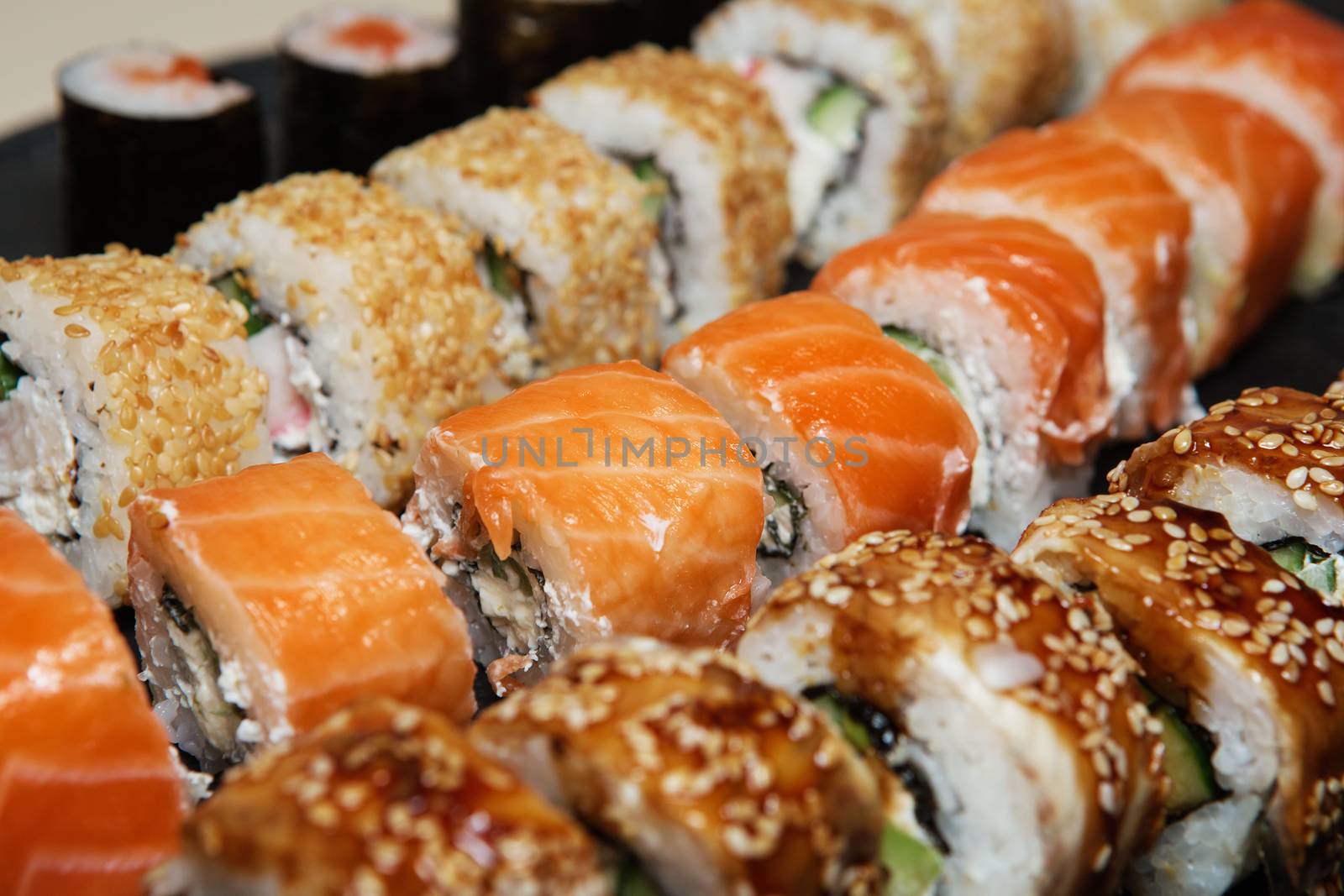 Best Types of Sushi Rolls. Philadelphia Roll, California Roll, Eel Avocado Roll. Delicious rolls and sushi with eel, salmon, shrimp, cucumber and philadelphia. Various delicious Types of Sushi Rolls