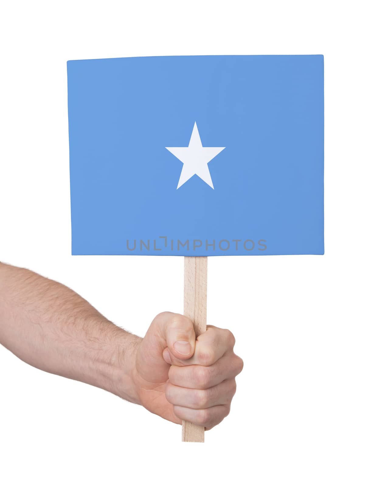 Hand holding small card, isolated on white - Flag of Somalia