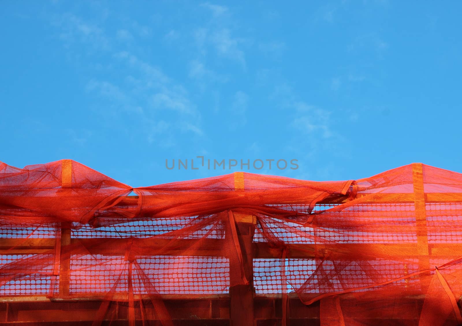 Red Construction Barrier on Wooden Planks and Empty Blue Sky