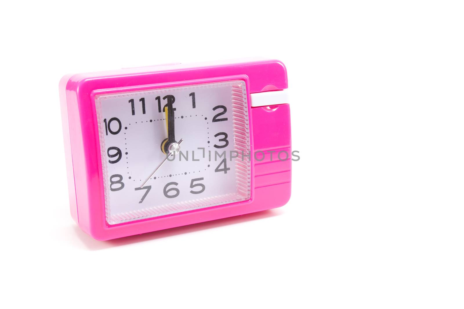 Pink alarm clock isolated on white background