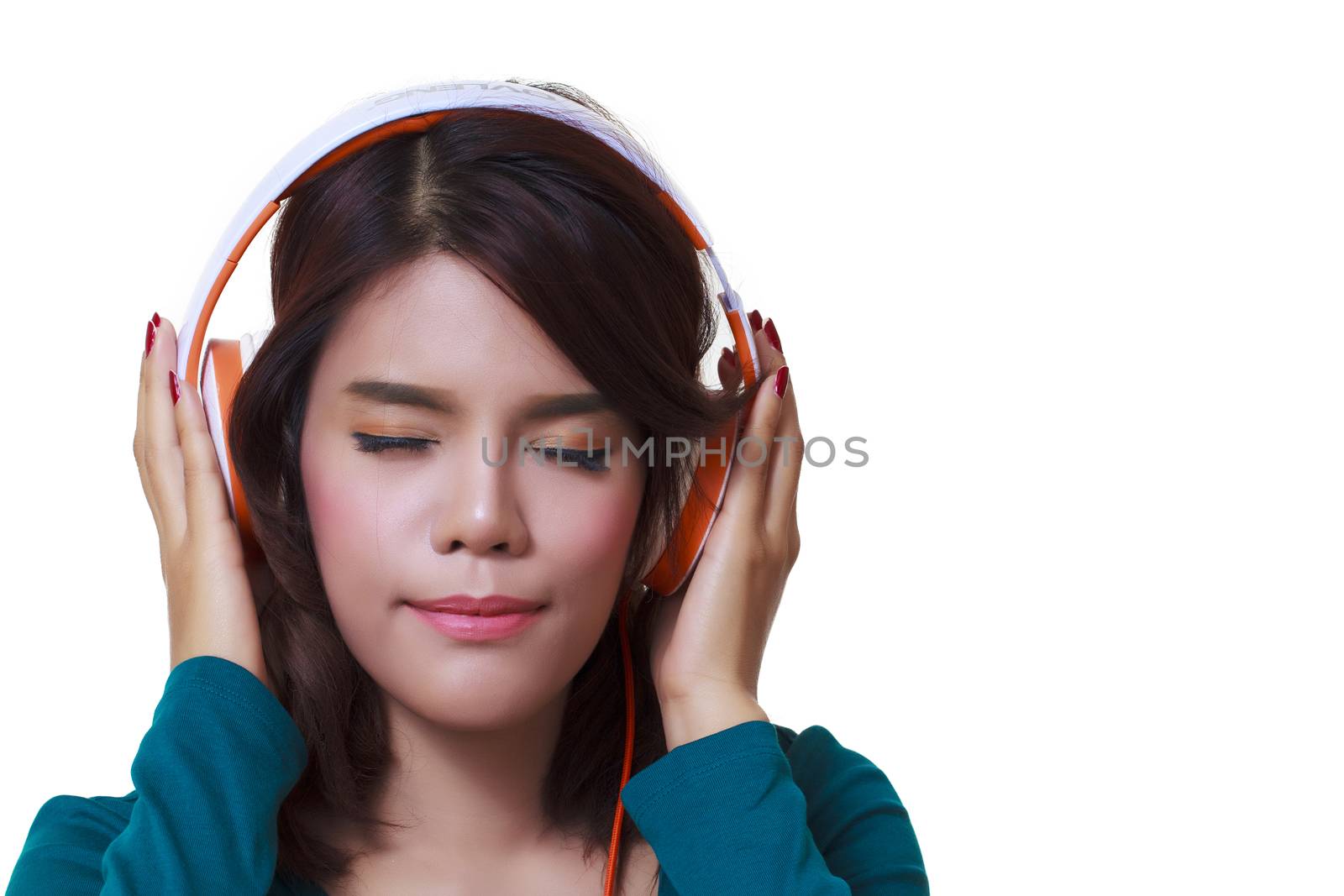 Beautiful young woman with headphones listening to the music