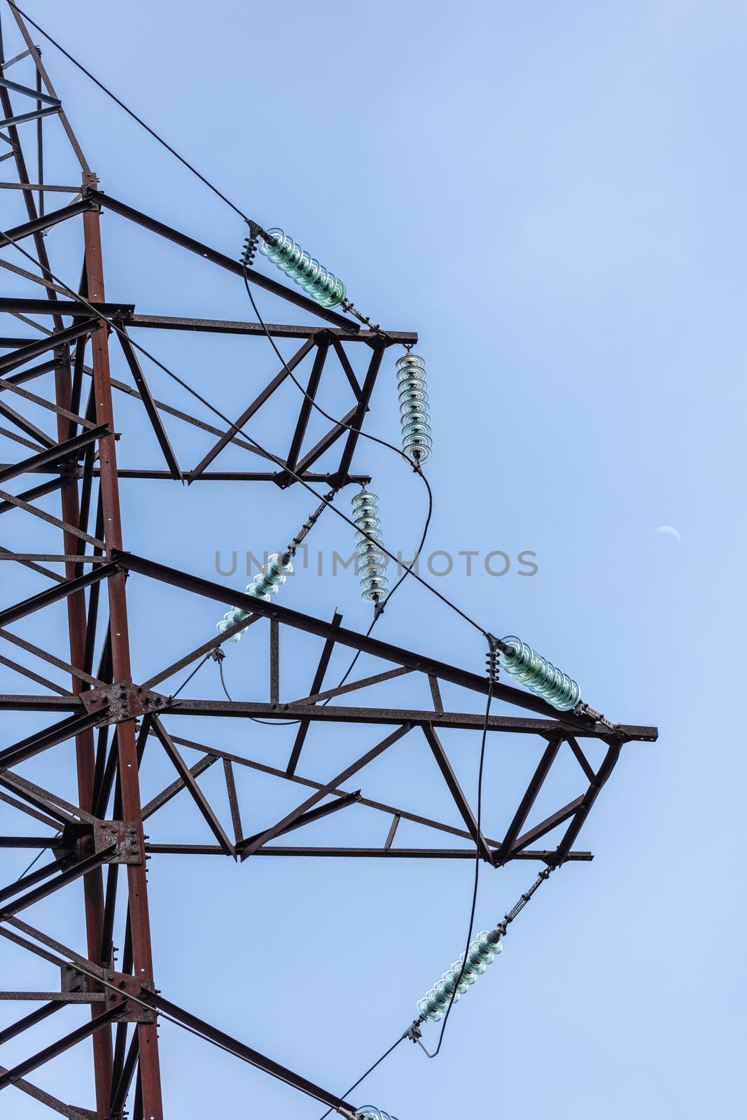 high voltage electric pole on the background of sky