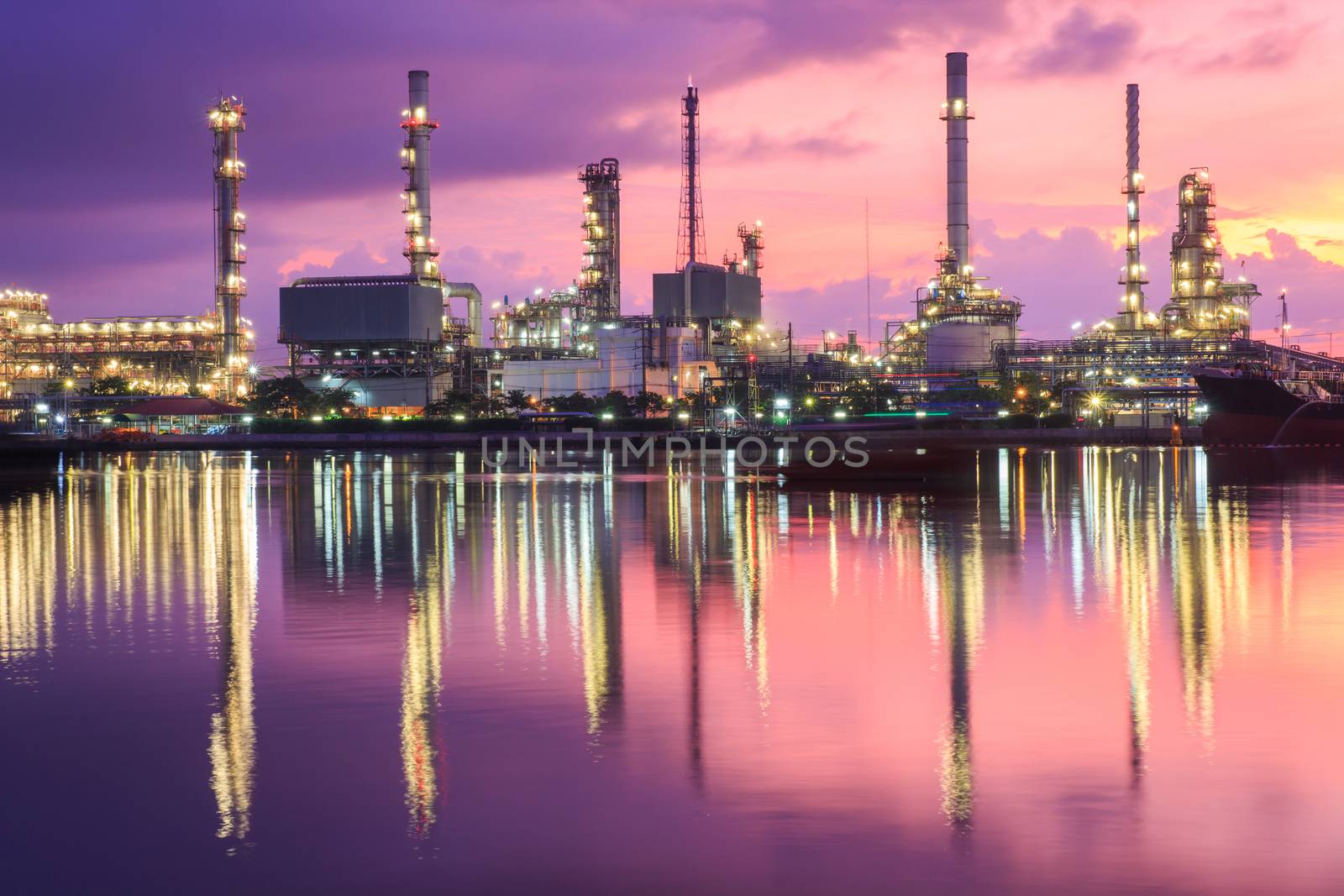 Oil refinery industry plant at dramatic twilight in morning