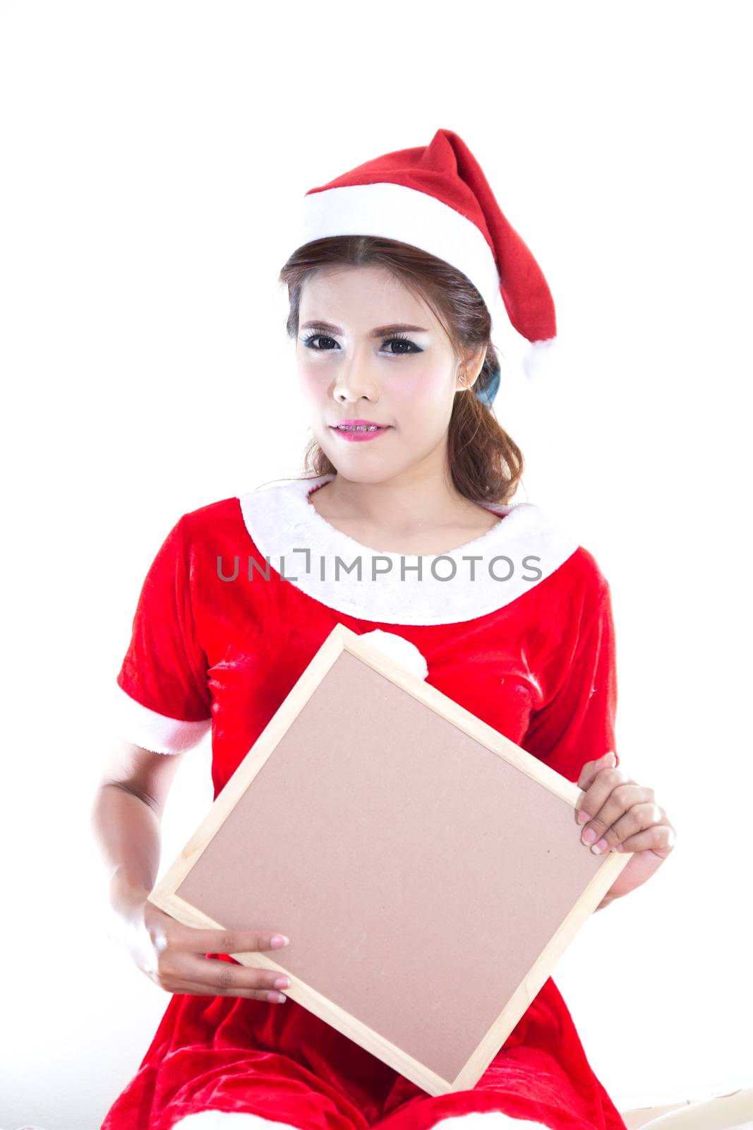 Beautiful women asian hold wood board in red santa dress. christmas concept