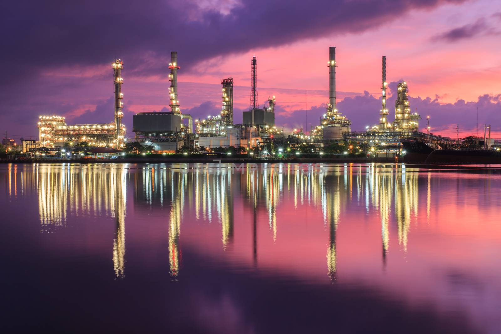 Oil refinery industry plant at dramatic twilight in morning