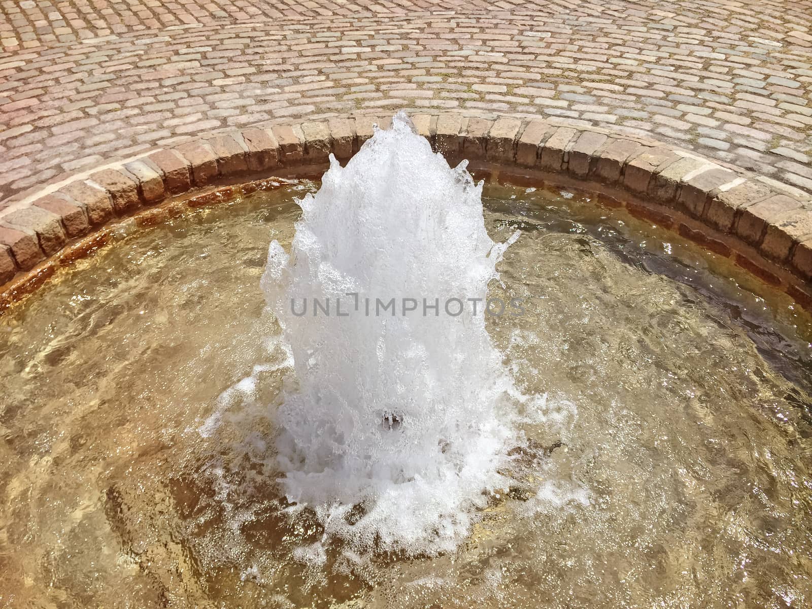 Little fountain on a city square by anikasalsera