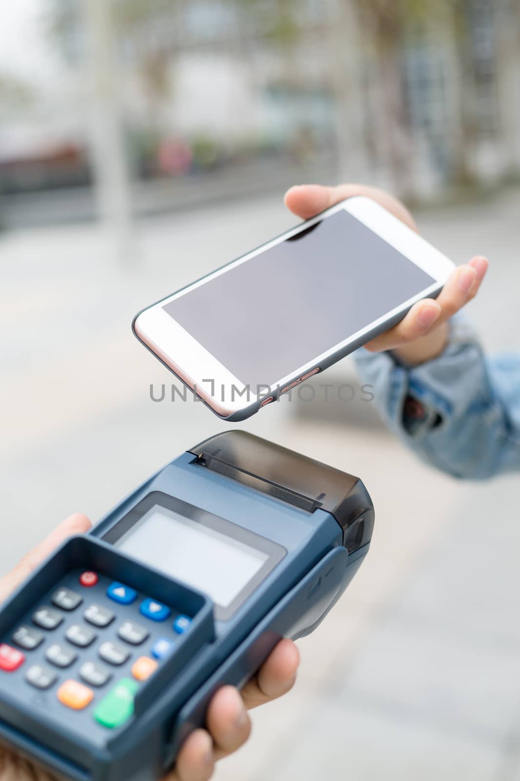 Customer using mobile phone to checkout