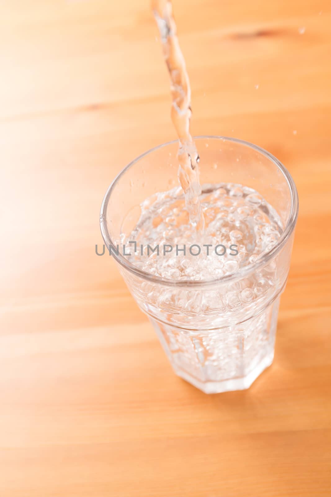 Pouring water to the glass